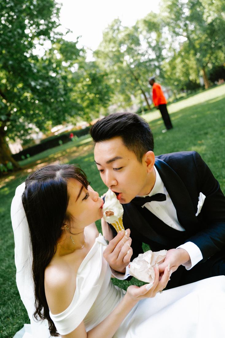 Groom stealing a bite of ice cream