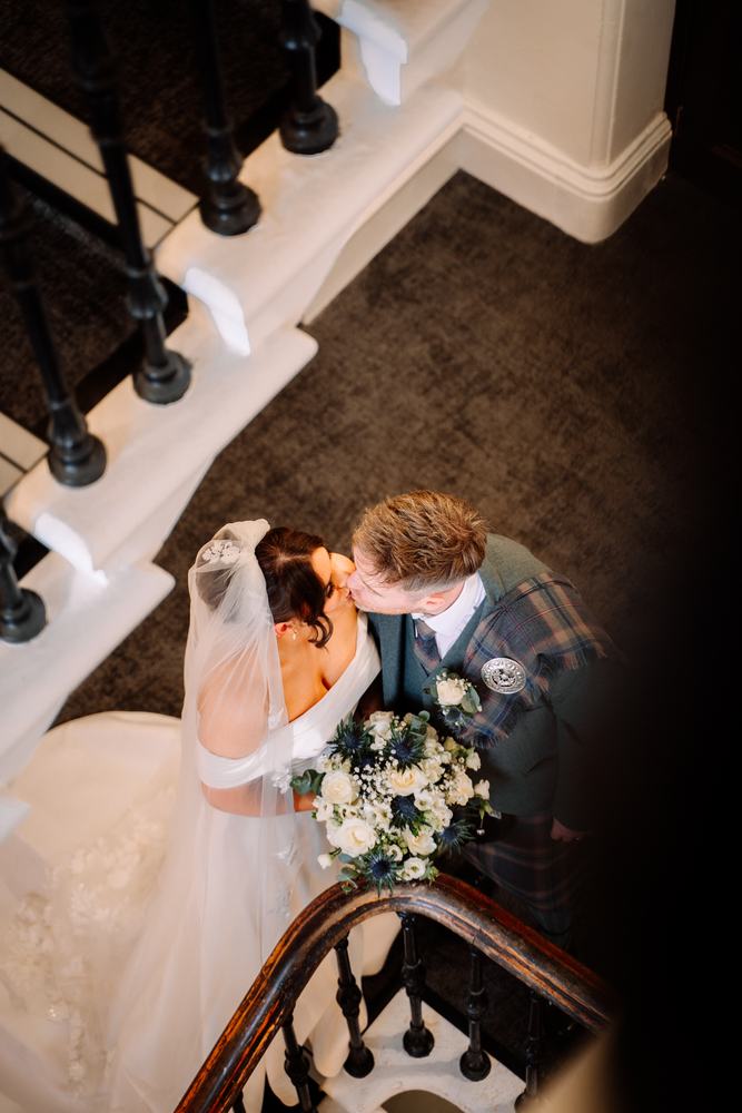 Couple seen from above on a spiral staircase