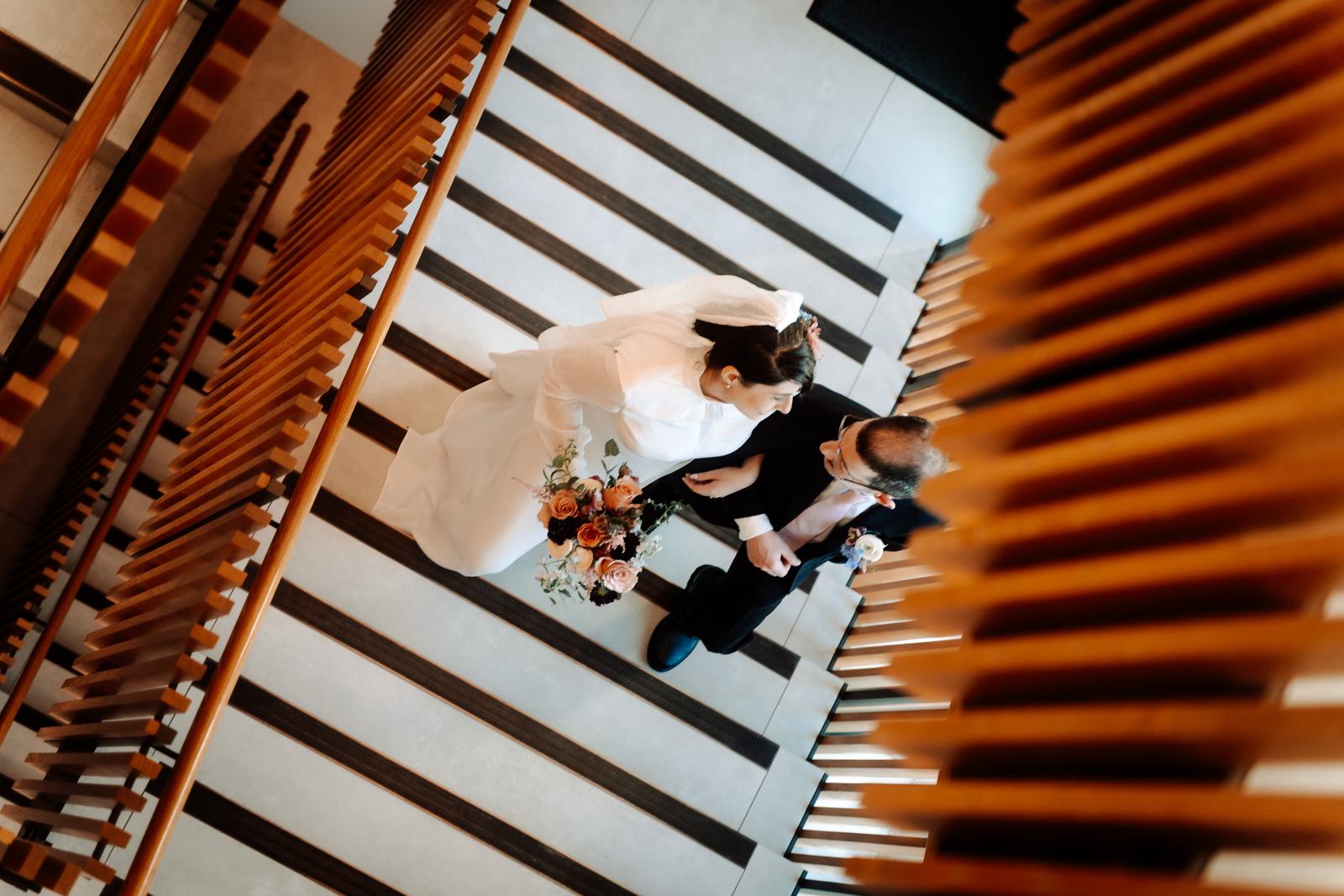 Couple seen from above on a staircase